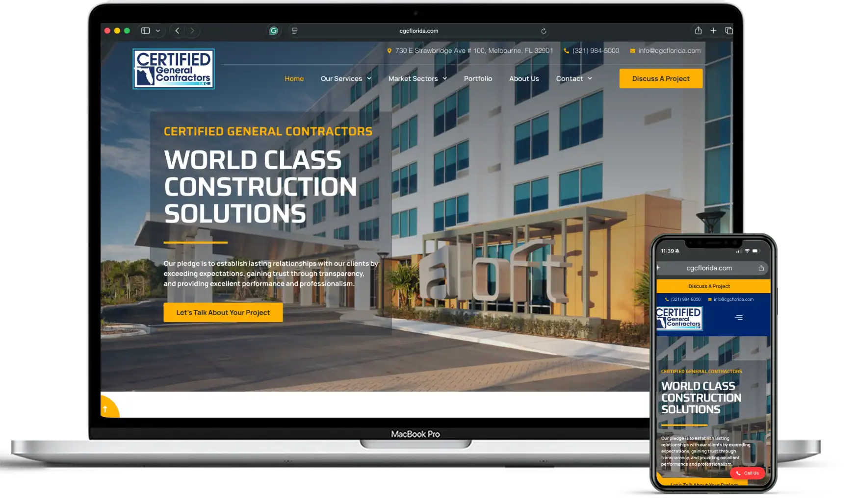 Construction company website displayed on laptop and mobile device screens.